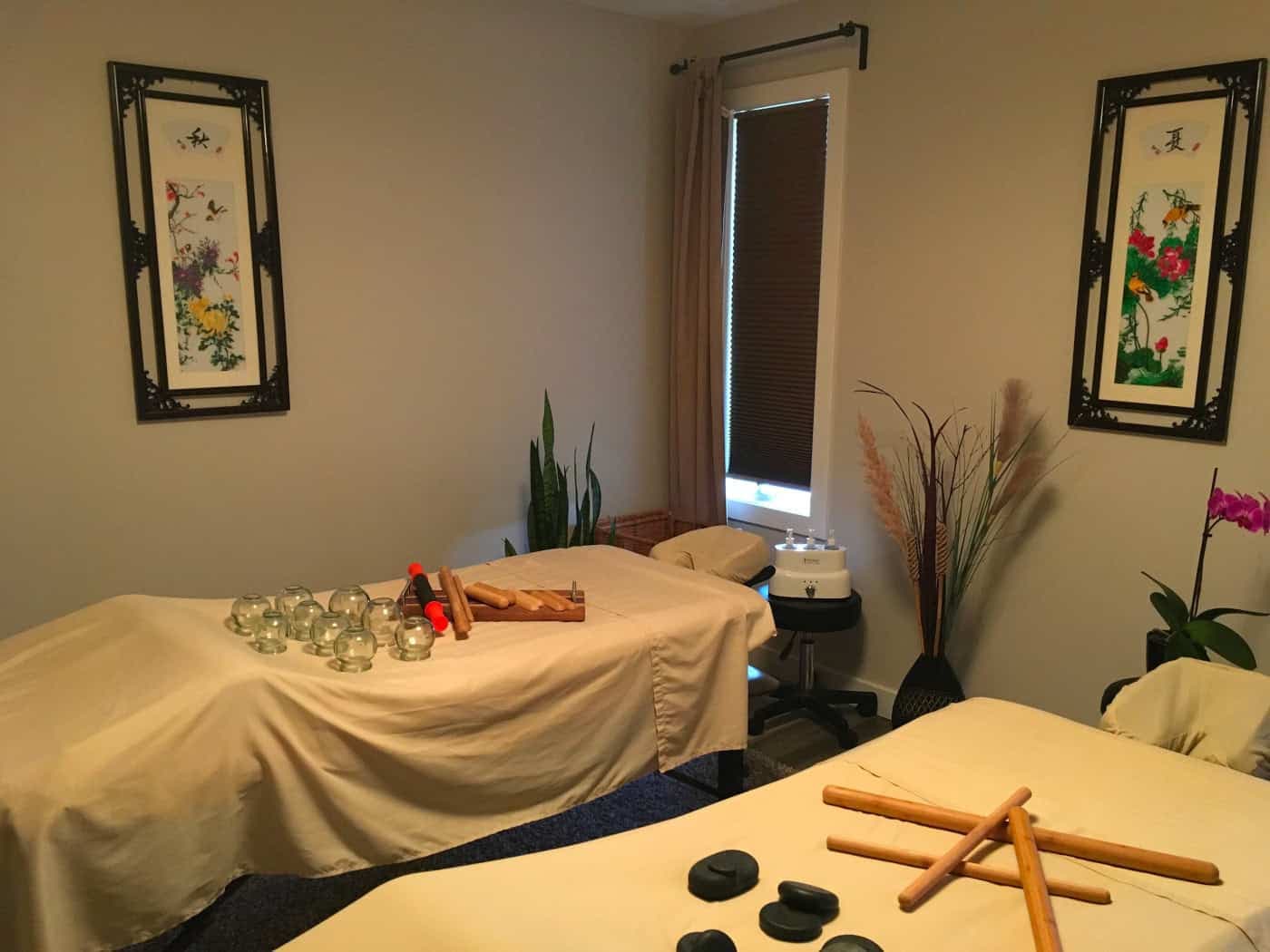 Two massage tables prepared for a couples session